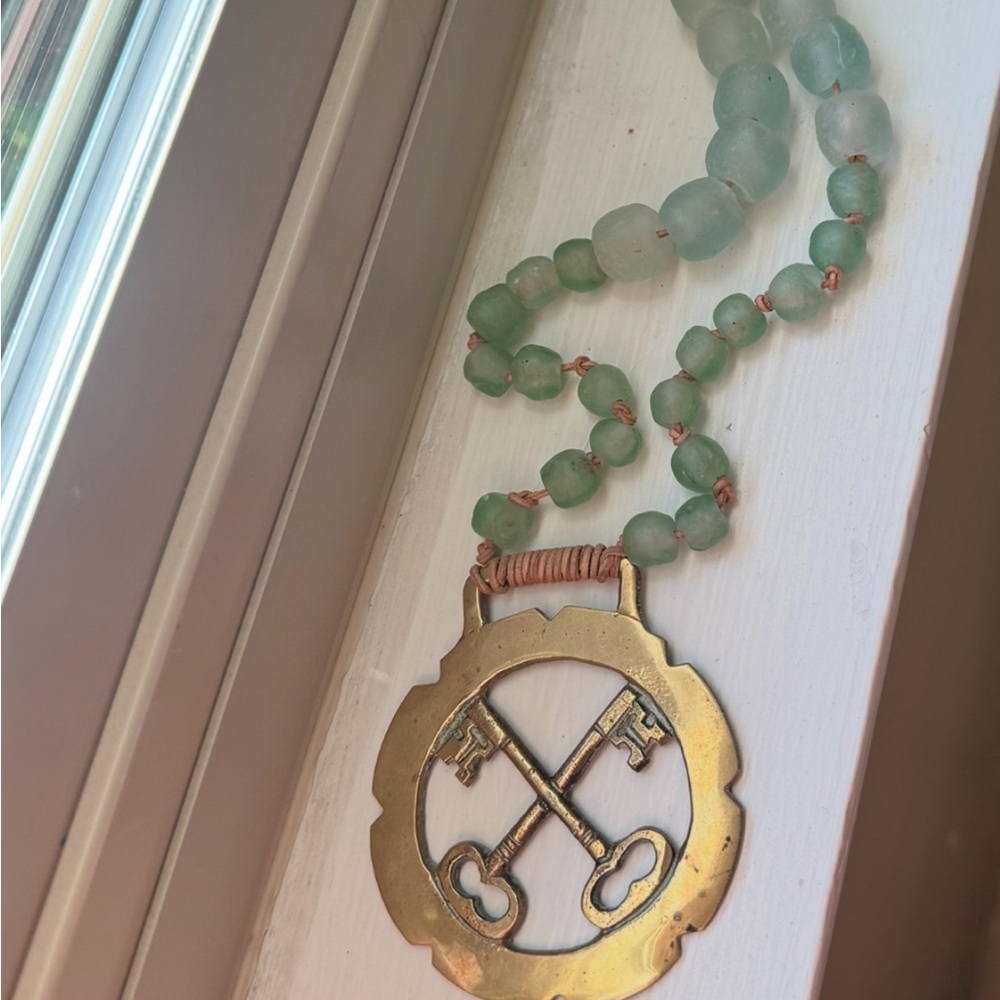 Horse Brass pendant on a necklace of Sea Beads
